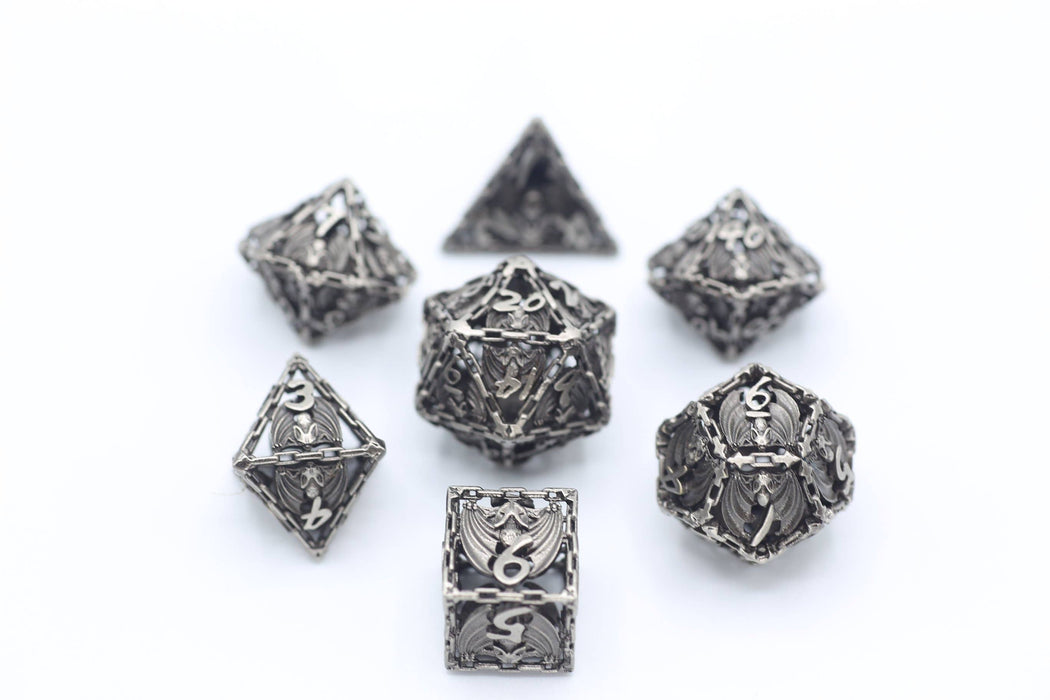 Ancient Silver Hollow Metal Bat Polyhedral Dice Set - for just $69.99! 