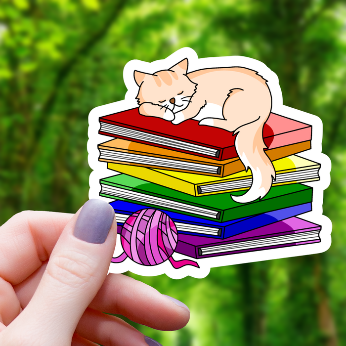 Cat Sleeping on top of Pride Books Sticker - 3" - for just $3.50! 