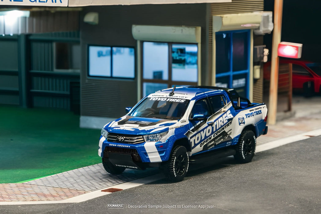 Tarmac Works 1:64 Toyota Hilux Blue/White - for just $22.99! 