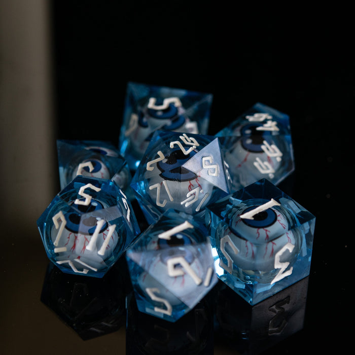 The Watcher: Blue-Eyed Liquid Core Dice Set - Just $59.99! Shop now at Retro Gaming of Denver