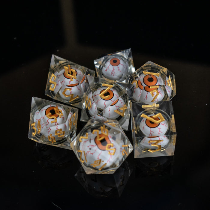 The Watcher: Orange-Eyed Liquid Core Dice Set - Just $59.99! Shop now at Retro Gaming of Denver