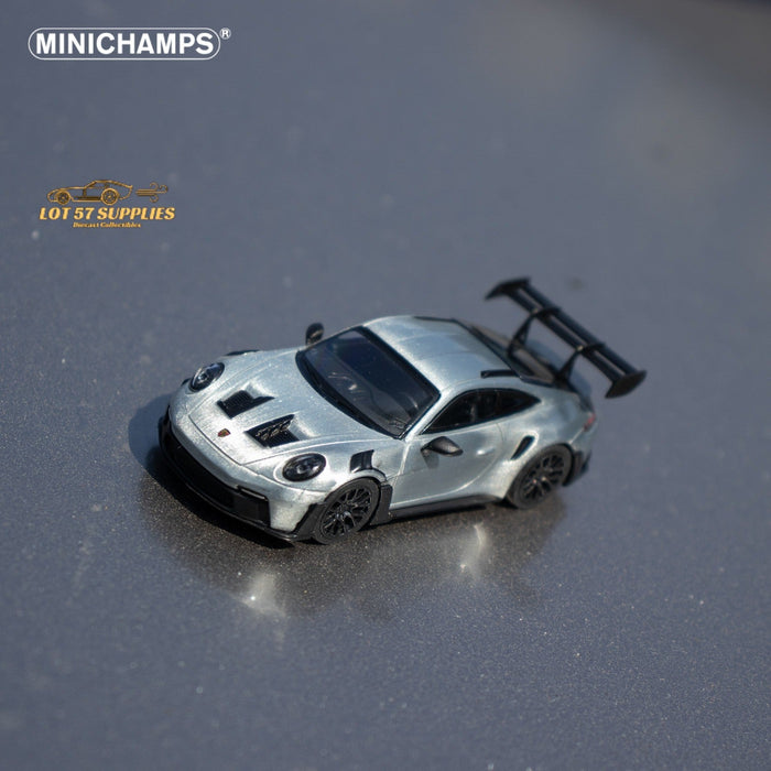 Minichamps X CLDC Exclusive Porsche 911 GT3 RS in Raw Silver English Magazine Version 1:64 (MAGAZINE INCLUDED) - Just $54.99! Shop now at Retro Gaming of Denver