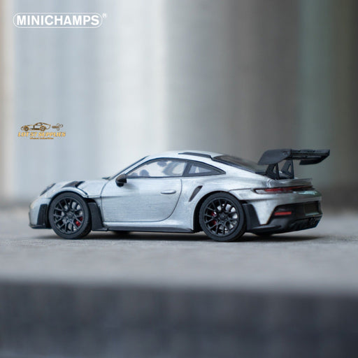 Minichamps X CLDC Exclusive Porsche 911 GT3 RS in Raw Silver English Magazine Version 1:64 (MAGAZINE INCLUDED) - Just $54.99! Shop now at Retro Gaming of Denver