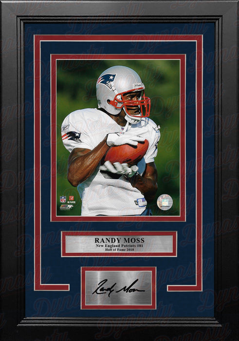 Randy Moss in Action New England Patriots 8" x 10" Framed Football Photo with Engraved Autograph - for just $79.99! 