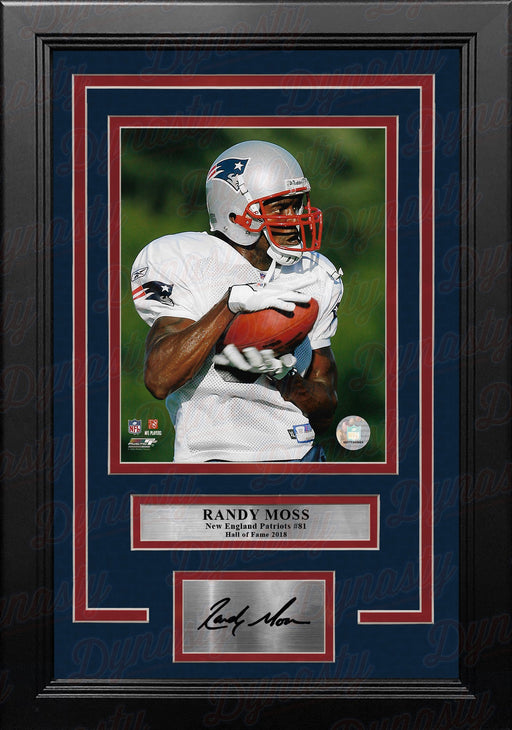 Randy Moss in Action New England Patriots 8" x 10" Framed Football Photo with Engraved Autograph - for just $79.99! 