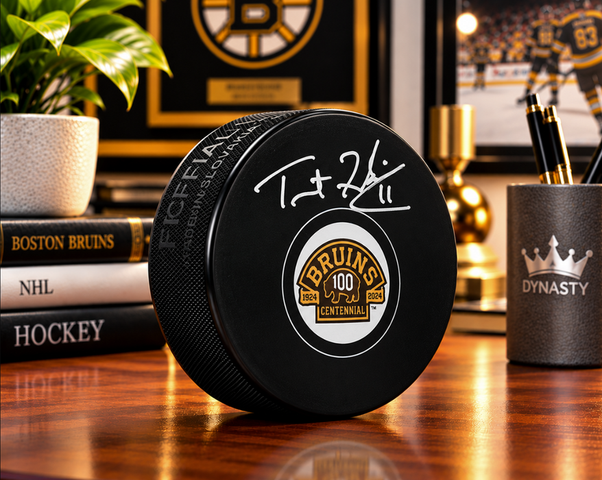 Trent Frederic Autographed Boston Bruins 100th Anniversary Hockey Logo Puck - for just $29! 