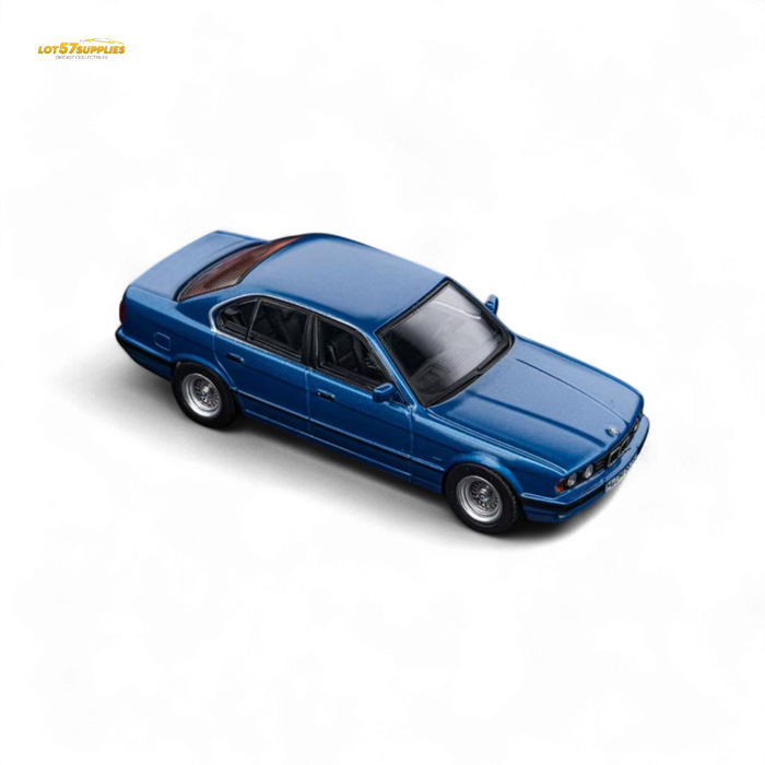 DCM BMW E34 5-Series Sedan Avis Metallic Blue 1:64 - for just $29.99! 