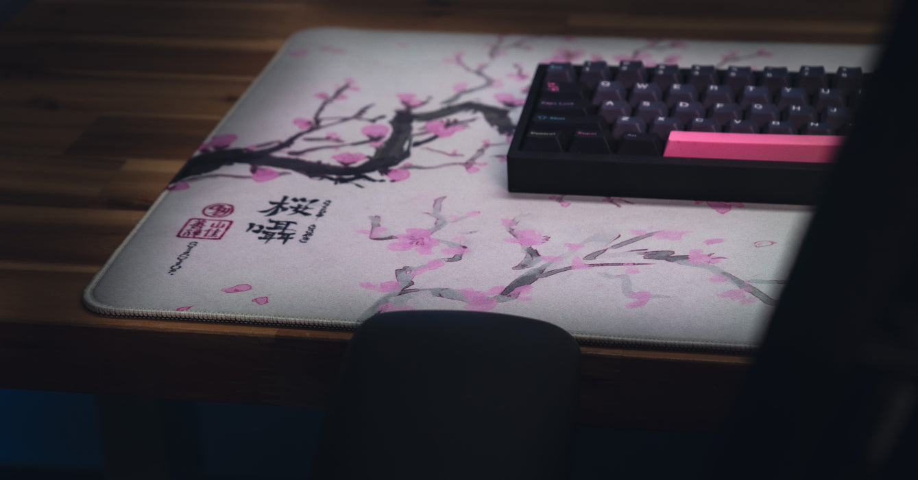"Whispers of Sakura" — Cherry Blossom Deskmat - for just $49.95! 