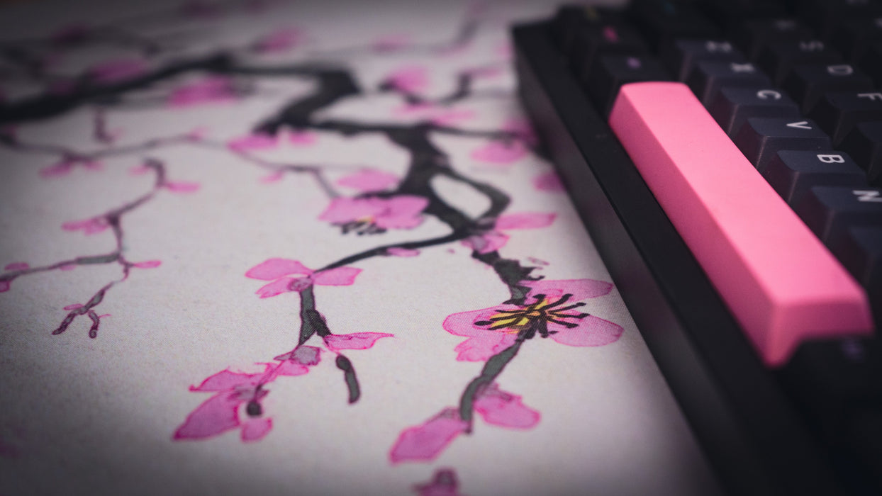 "Whispers of Sakura" — Cherry Blossom Deskmat - for just $49.95! 