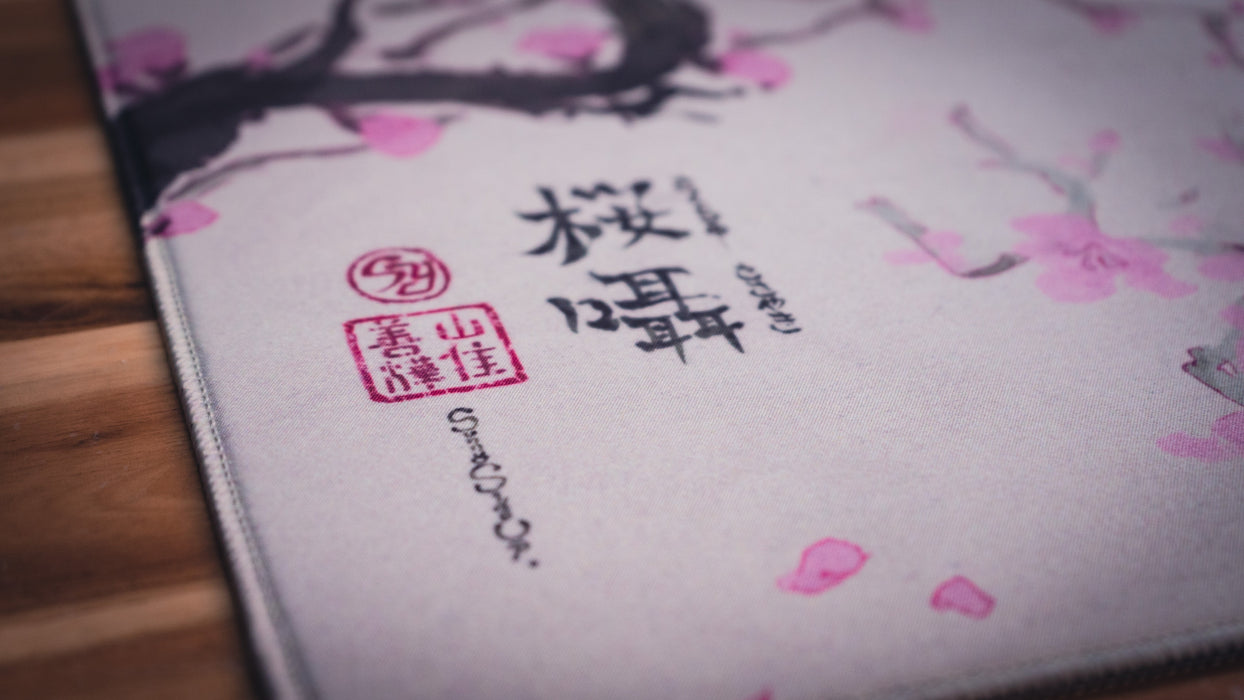 "Whispers of Sakura" — Cherry Blossom Deskmat - for just $49.95! 