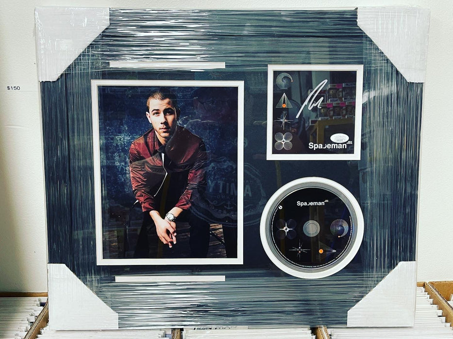 Nick Jonas Signed & Custom Framed Spaceman CD Insert With JSA COA - for just $350! 