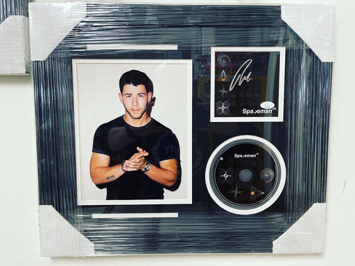 Nick Jonas Signed & Custom Framed Spaceman CD Insert With JSA COA - for just $350! 