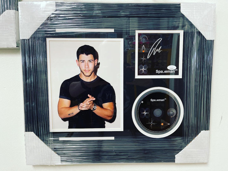 Nick Jonas Signed & Custom Framed Spaceman CD Insert With JSA COA - for just $350! 