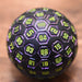 The Orb D100 -  Purple, Neon Green, and Black Metal Die - Just $39.99! Shop now at Retro Gaming of Denver