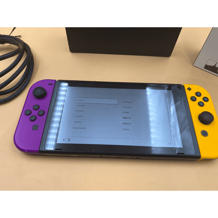 Nintendo Switch With Purple And Yellow Joy-Con - Premium Video Game Consoles - Just $309.99! Shop now at Retro Gaming of Denver
